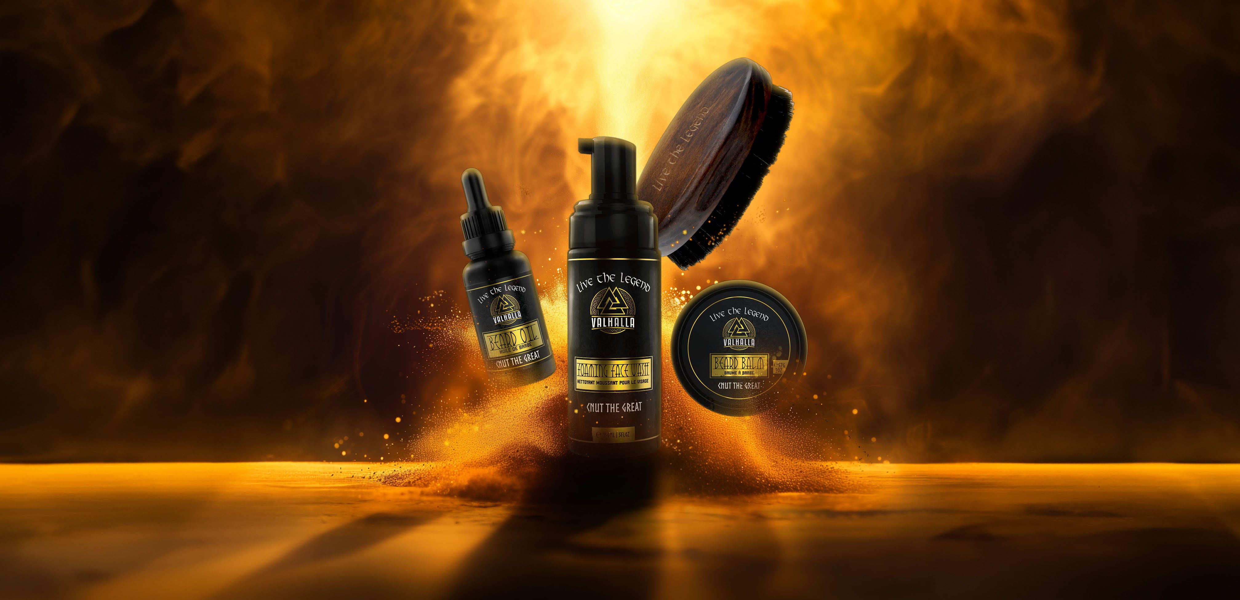 Beard Wash, Beard Oil, Beard Balm and a beard brush all emerging from a golden burst of gold dust and light